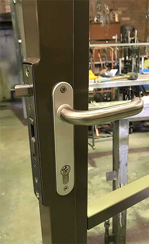 H Metal lock installed into a gate frame