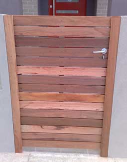 front view of a gate cladded with timber