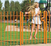 girl on a gate swinging 