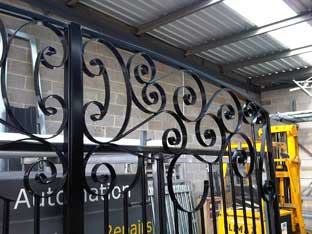 wrought iron scroll work in a gate 