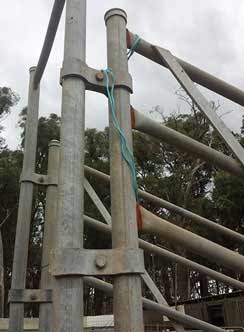 Farm stockyard clamp and hinge on a loading ramp for trucks