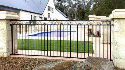 a steel panel with wrought iron work between pillars 