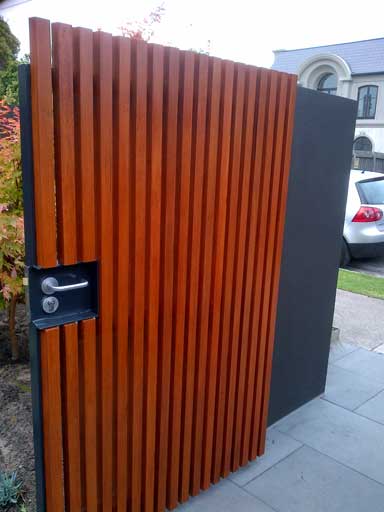 timber cladded single gate with a mortice lock built in 