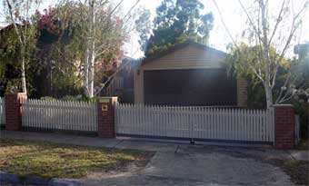 Rising hinge gate closed front view