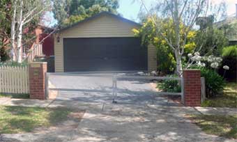 steel gate frame with rising hinges open driveway