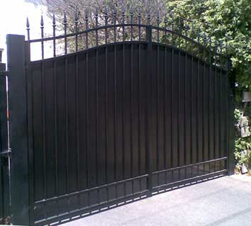 pair od driveway gate with a backing sheet for block out 