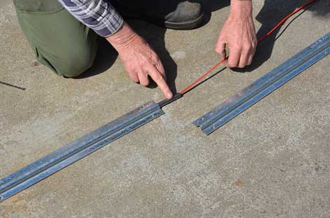 inserting wire under slding gate track